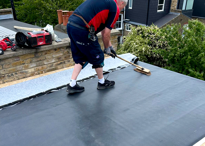 Pimlico Plumbers roofer installing rubber roof