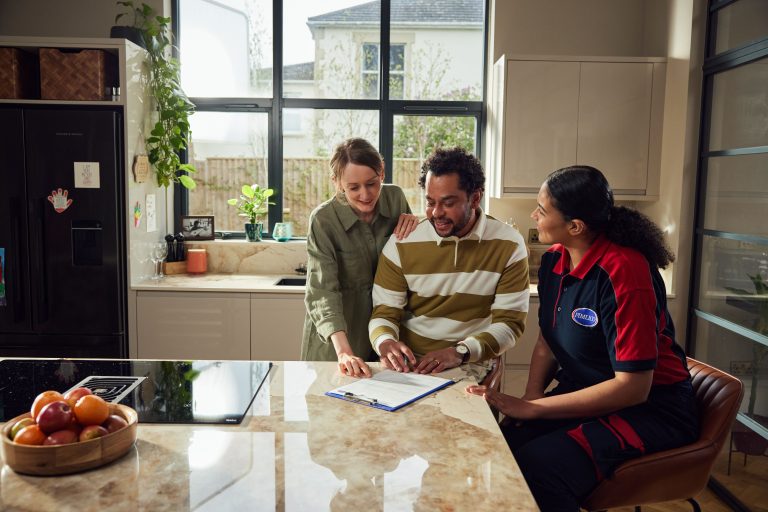 pimlico plumber providing quote at the kitchen table